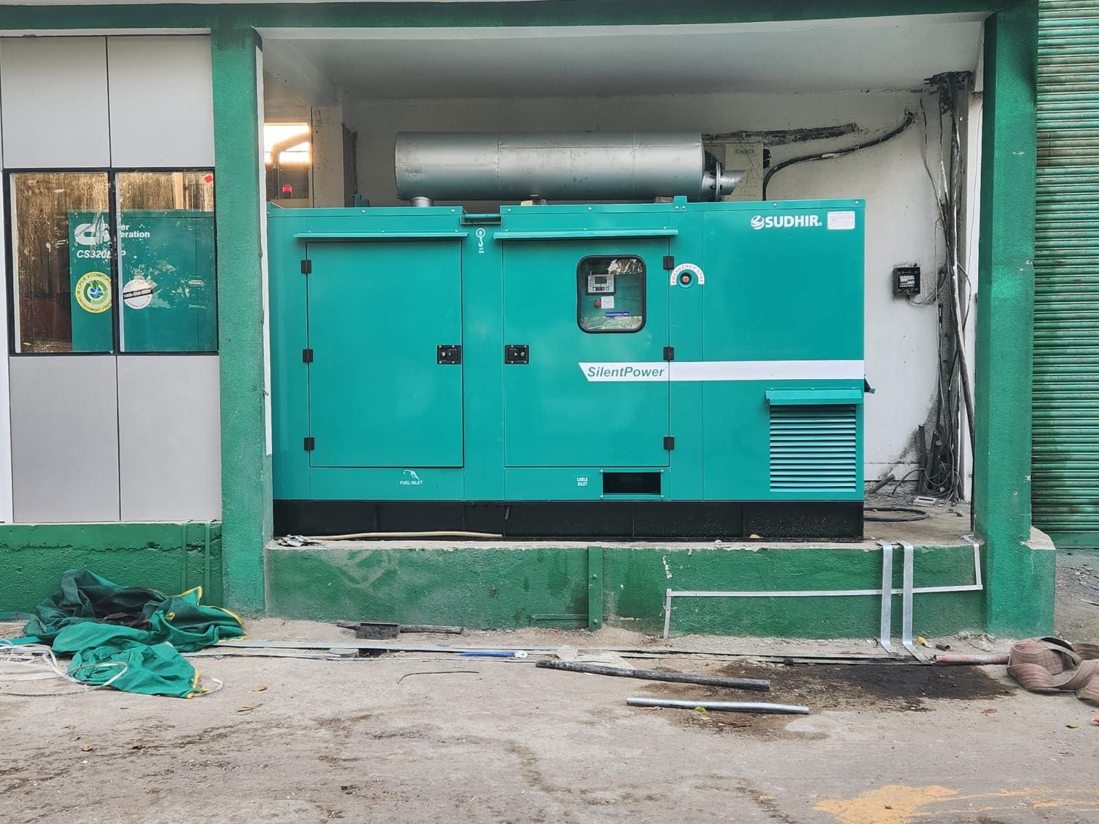 An installed 320 kVA Cummins silent DG set with residential silencer