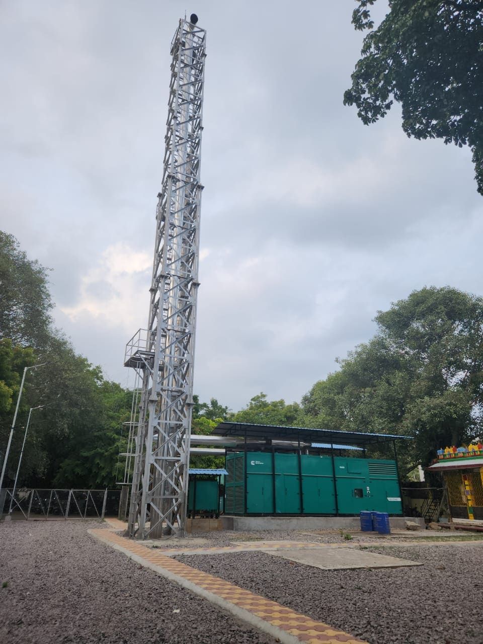 Completed 30 metre lattice stack beside a 1500 kVA DG enclosure