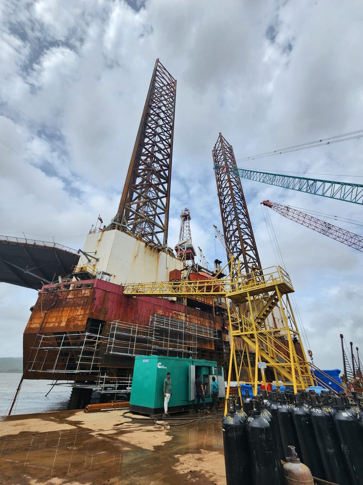 A silent DG set on a dockside powering refit work at the base of a jack-up rig