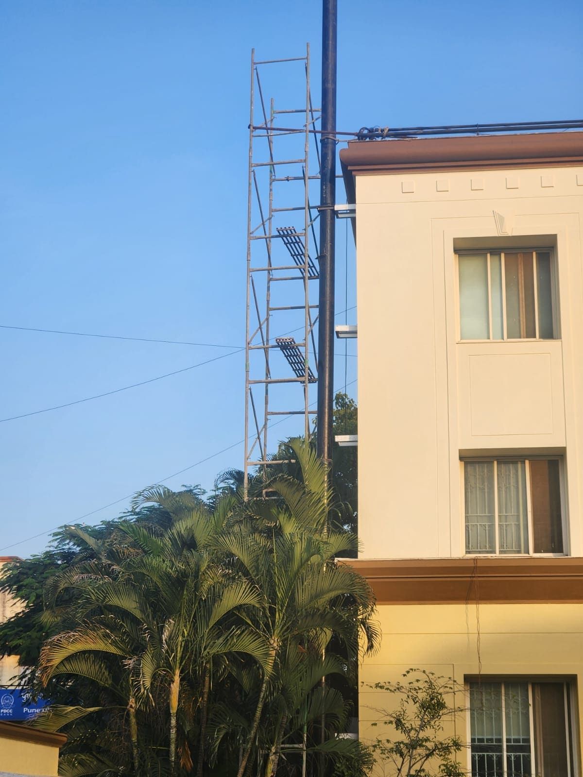 A DG exhaust line routed up a building facade above roof height