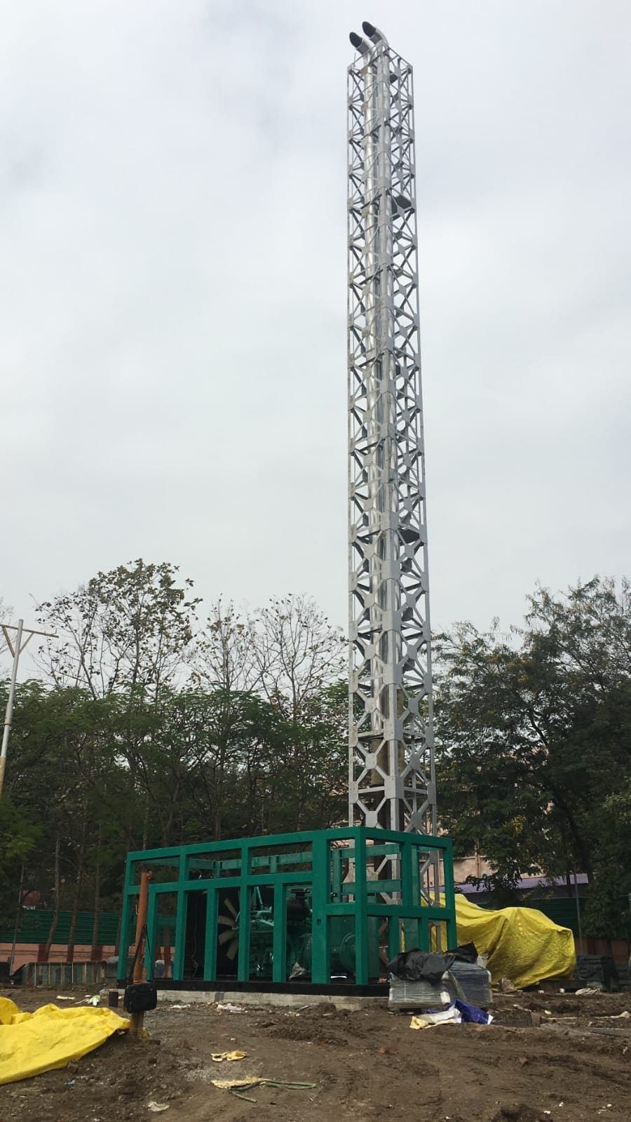 Erected 30 metre lattice exhaust stack with a DG enclosure at its base