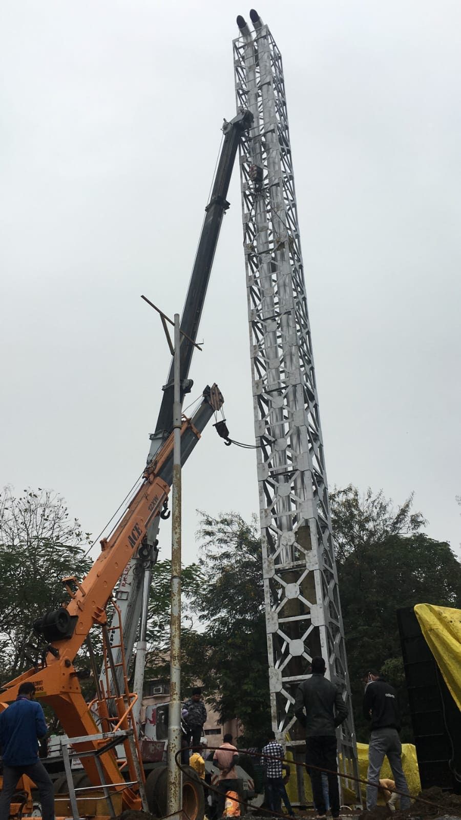Mobile crane erecting a 30 metre twin-flue lattice exhaust stack